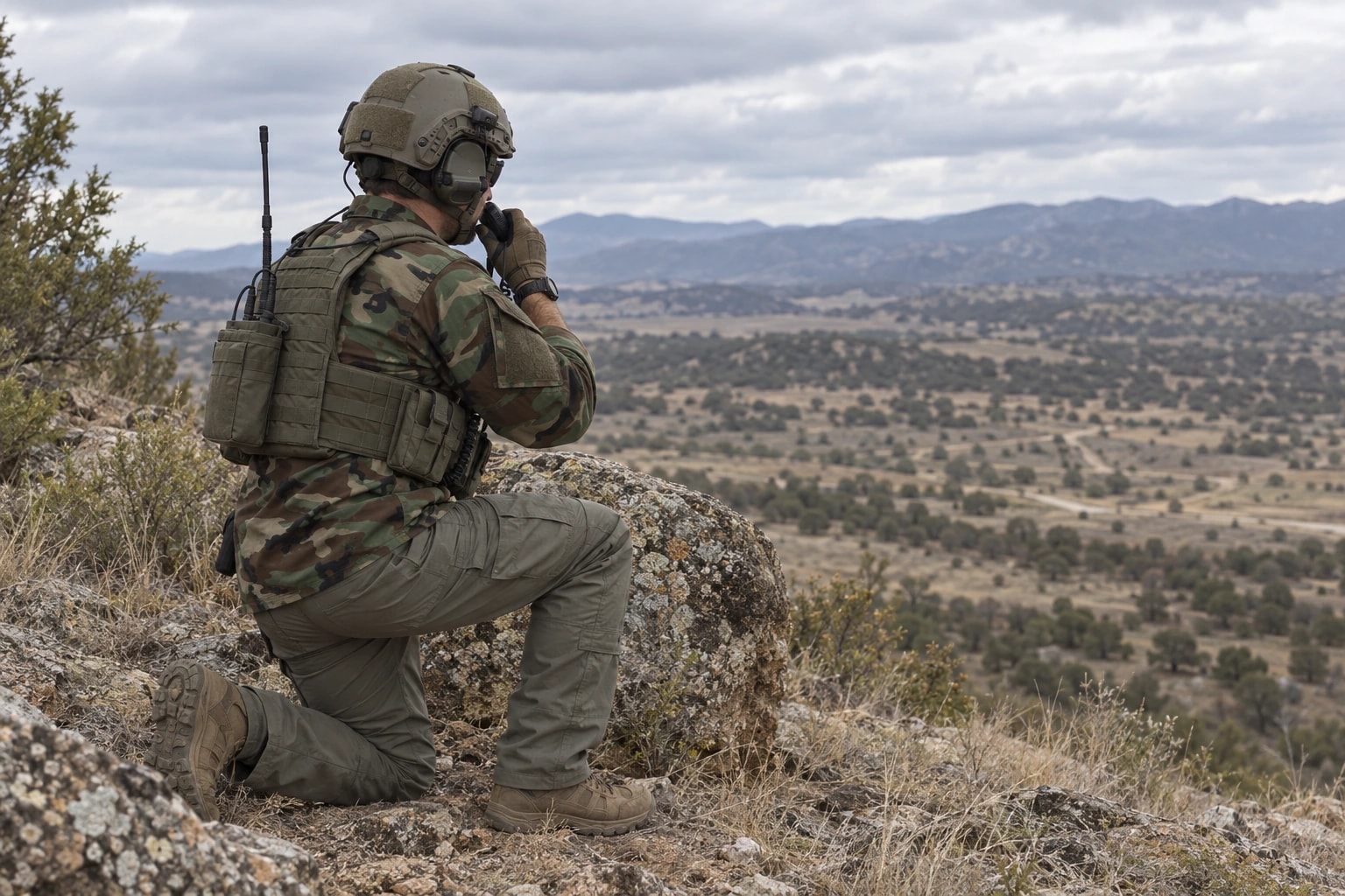 A joint terminal attack controller communicates by radio during field training.